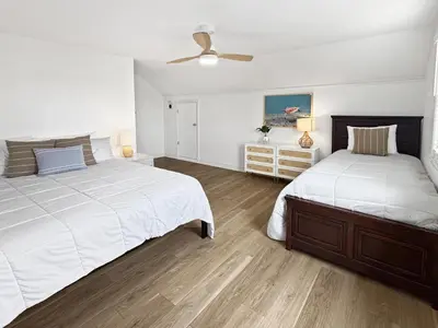a bedroom with two beds and a ceiling fan at F-75 Terramar Cliffs in Carlsbad