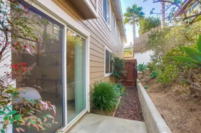 a house with a sliding glass door on the side of it at F-78 Seaside Escape in Encinitas