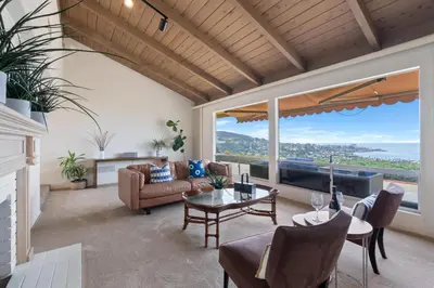 a living room with a couch and a table at La Jolla Shores Views in San Diego