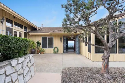 a house with a tree in front of it at La Jolla Shores Views in San Diego