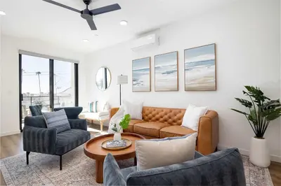 a living room with a couch and chairs and a table at Walk to the Beach & Pier Ocean View Roof Deck in Oceanside