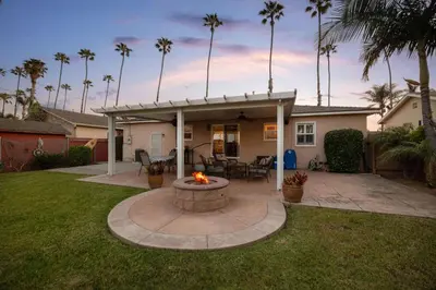 a backyard with a fire pit in the yard at Walk to the Beach Private Backyard and Fire Pit in Oceanside