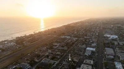 an aerial view of a beach at sunset at Walk to the Beach Private Backyard and Fire Pit in Oceanside
