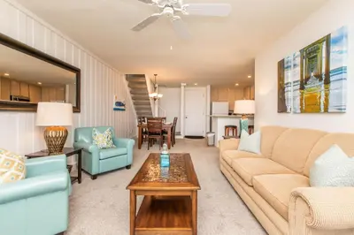 a living room with a couch and chairs and a table at Penthouse Ocean & Sunset Balcony Views - G-323 in Oceanside