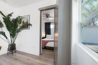 a bedroom with a mirror and a bed in it at Luxury Home with Spacious Backyard - Sleeps 12 in Poway