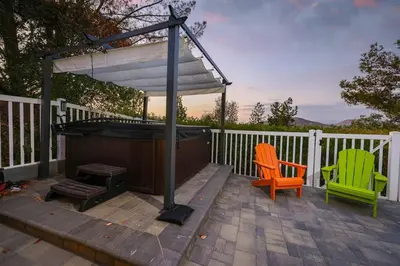 a gazebo and two chairs on a deck at Hot Tub with A View and Large Back Deck & Game Room in Poway