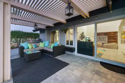 a patio with a couch and chairs on a patio at Hot Tub with A View and Large Back Deck & Game Room in Poway