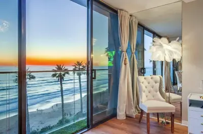 a living room with a view of the ocean at Panoramic Ocean Views Beach & Boardwalk Access in San Diego