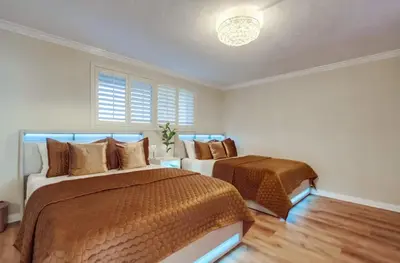 a bedroom with two beds and a window at Panoramic Ocean Views Beach & Boardwalk Access in San Diego