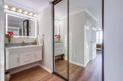 a bathroom with a sink and a mirror at Panoramic Ocean Views Beach & Boardwalk Access in San Diego