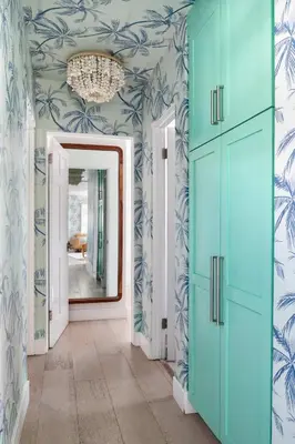 a hallway with blue and white walls and a mirror at Inviting 3BR Near Mission Beach in San Diego