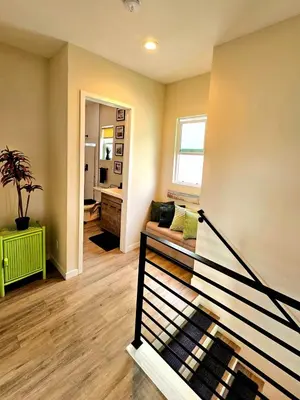 a living room with a couch and a window at Heights Golden Luxe Retreat in San Diego