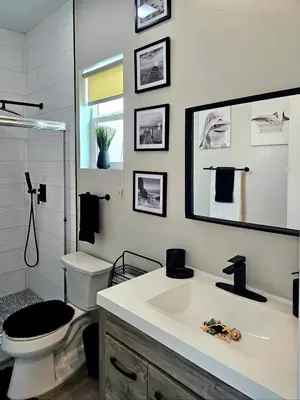 a bathroom with a white sink and a toilet at Heights Golden Luxe Retreat in San Diego