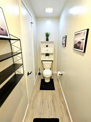 a small bathroom with a toilet in a room at Heights Golden Luxe Retreat in San Diego