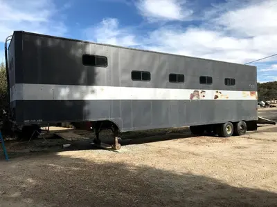 a large silver truck parked in a parking lot at Vintage Tiny House with Spa-Inspired Bathroom in Warner Springs, California in Warner Springs