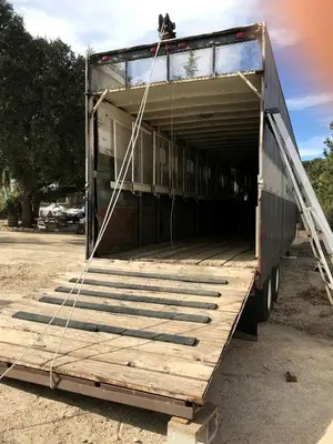 a truck is being pulled into a building at Vintage Tiny House with Spa-Inspired Bathroom in Warner Springs, California in Warner Springs