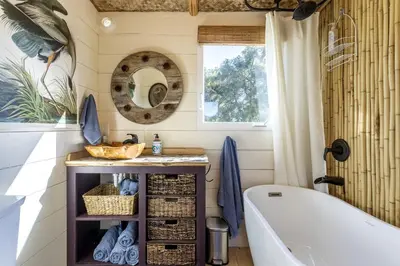 a bathroom with a tub and a sink and a toilet at Vintage Tiny House with Spa-Inspired Bathroom in Warner Springs, California in Warner Springs