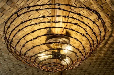 a large light fixture hanging from a ceiling at Vintage Tiny House with Spa-Inspired Bathroom in Warner Springs, California in Warner Springs