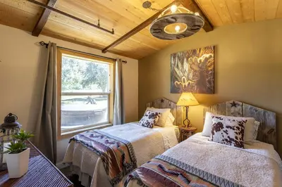 a bedroom with two beds and a window at Unique Western-Themed Cabin Rental for Secluded Getaway in Warner Springs, California in Warner Springs