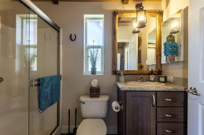 a bathroom with a toilet and a sink and a shower at Unique Western-Themed Cabin Rental for Secluded Getaway in Warner Springs, California in Warner Springs