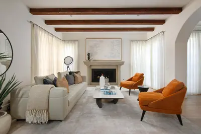 a living room with a white couch and a fireplace at 3BR La Jolla Village Walk to Beach in San Diego