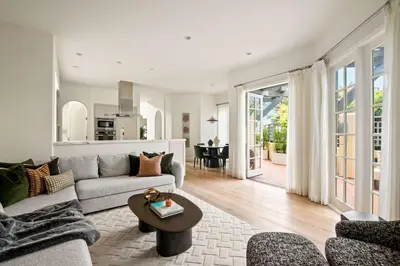 a living room with a couch and a table at 3BR La Jolla Village Walk to Beach in San Diego