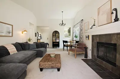 a living room with a couch and a fireplace at Carmel Valley 2BR with Amenities in San Diego