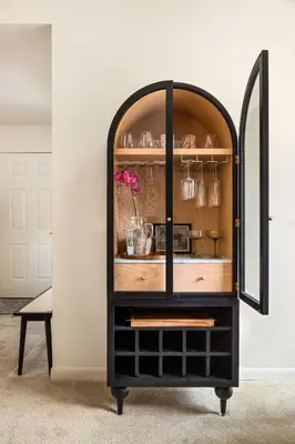 a black cabinet with a mirror in a room at Carmel Valley 2BR with Amenities in San Diego
