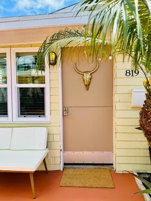 a front door of a house with a cow head on the door at Casa Luna in San Diego