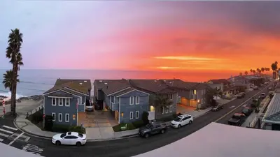 a view of a street with houses and the ocean at Tower 9 Oceanview House in Oceanside