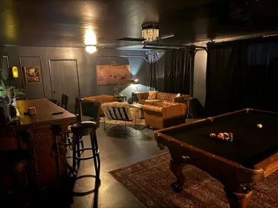 a living room with a pool table and a couch at Luxury 5 bedroom Wine Retreat Fallbrook Villa sleeps 12 in Fallbrook
