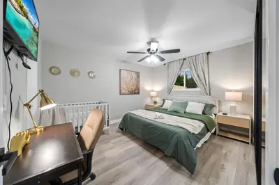 a bedroom with a bed and a desk and a piano at Entire Private Home with 3 Bedrooms 2 Bathrooms, Hot Tub, Garage, King Bed, Available Now in Spring Valley