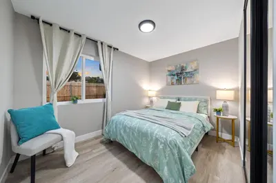 a bedroom with a bed and a window at Entire Private Home with 3 Bedrooms 2 Bathrooms, Hot Tub, Garage, King Bed, Available Now in Spring Valley