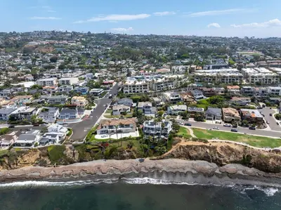 an aerial view of a city with houses and the ocean at Bird Rock Dream - Pool, Spa, and Stunning Ocean View! in San Diego