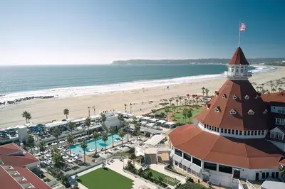 a building on the beach next to a beach at Entire Private Studio with 1 King Bed, Full Kitchen, Gated Yard, Available Now in Spring Valley