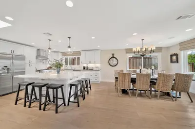 a kitchen and dining room with a table and chairs at Monthly 4BD4BA LuxuryHot TubPool TableYard in San Clemente