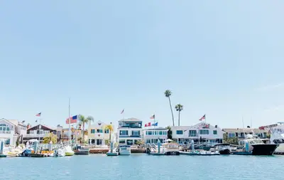 a group of boats docked in a marina at Steps to SandParkingACGround Level in Newport Beach
