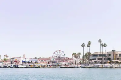 a marina with boats and a ferris wheel at Steps to SandParkingACGround Level in Newport Beach