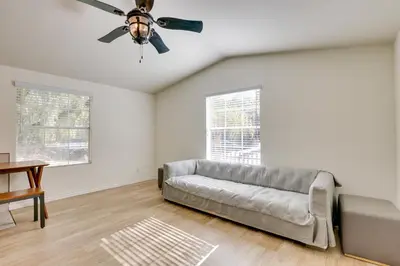 a living room with a couch and a ceiling fan at Hike, Explore and More Ranch Retreat in Escondido! in Valley Center