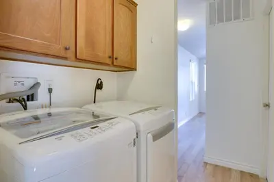 a white laundry room with a washer and dryer at Hike, Explore and More Ranch Retreat in Escondido! in Valley Center