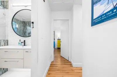 a white bathroom with a sink and a mirror at Nature-Inspired Stay with Pool, Fire Pits and More in El Cajon