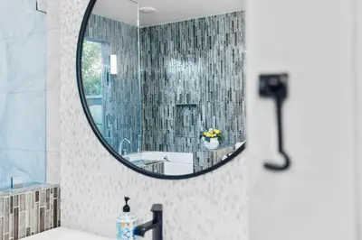 a bathroom mirror with a sink and a tub at Nature-Inspired Stay with Pool, Fire Pits and More in El Cajon