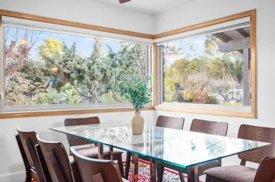 a dining room with a glass table and chairs at Nature-Inspired Stay with Pool, Fire Pits and More in El Cajon
