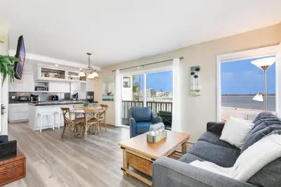 a living room with a couch and a table at Bayfront Oasis Close to Boardwalk and Water in San Diego