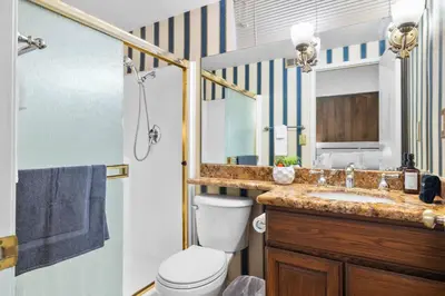 a bathroom with a sink and a toilet and a shower at Mira Mesa Family Retreat 4BR with Balcony and Firepit in San Diego