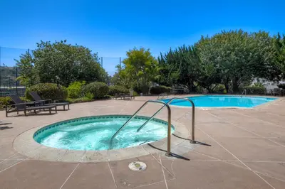 a small swimming pool with a metal railing next to it at Pool, Hot Tub, Steps To Omni La Costa in Carlsbad
