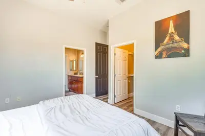 a bedroom with a bed and a picture of the eiffel tower at Family Hideaway with Hillside Views in Temecula! in Temecula