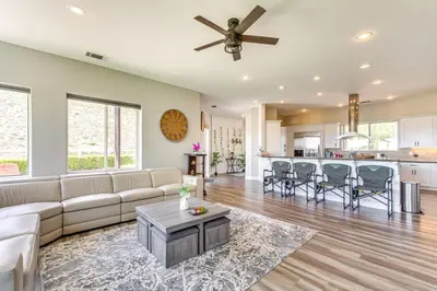 a living room with a couch and a table at Family Hideaway with Hillside Views in Temecula! in Temecula