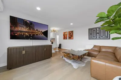a living room with a couch and a table at NEW 2BR, 1BA, Outdoor Fireplace, Patio Lounge, Western Vibes, Smart TVs, Ambient Lighting in San Diego