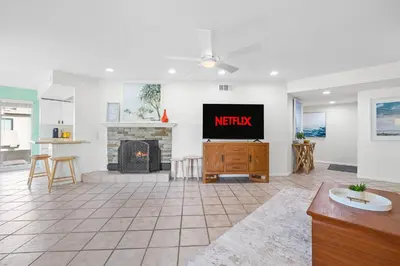 a living room with a tv and a fireplace at Charming Coastal Retreat in Solana Beach in Solana Beach